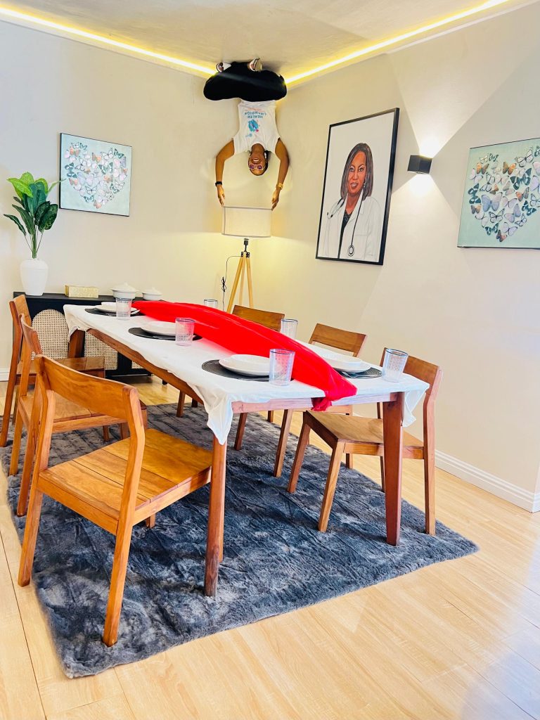 DRASA Health Trust team in the Landmark Upside Down House